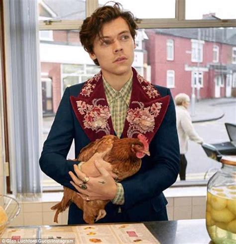 harry styles in gucci with a chicken